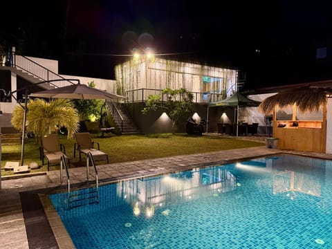 Property building, Night, Pool view, Swimming pool, sunbed