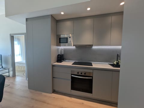 Kitchen or kitchenette, oven, stove