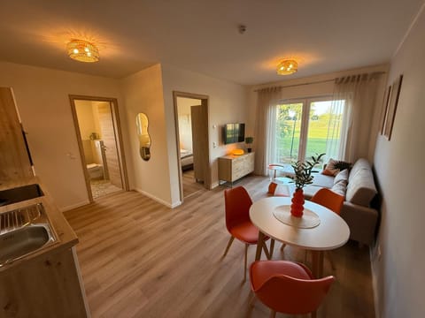 Kitchen or kitchenette, Living room, Seating area, Dining area