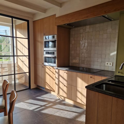 Kitchen or kitchenette, dishwasher, oven, stove