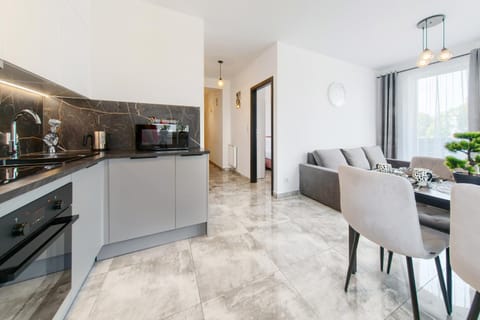 Kitchen or kitchenette, Living room, Seating area, Dining area, dishwasher, oven, stove