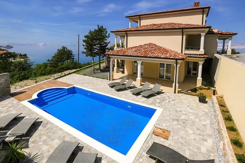 Property building, Patio, Natural landscape, Pool view, Sea view, Swimming pool