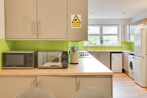 Kitchen or kitchenette, dishwasher, oven, stove, toaster