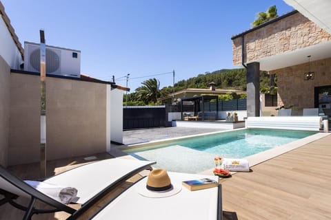 Property building, Patio, Day, Natural landscape, Pool view, Swimming pool, sunbed