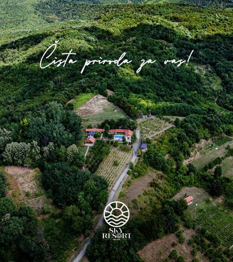Property building, Spring, Day, Property logo or sign, Neighbourhood, Natural landscape, Bird's eye view, Logo/Certificate/Sign, Mountain view