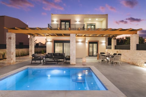Property building, Patio, Night, Pool view, Swimming pool, Swimming pool, sunbed