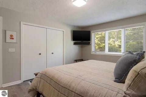 Scenic AGaMing Escape Torch Lake Views and Golf House in Torch Lake