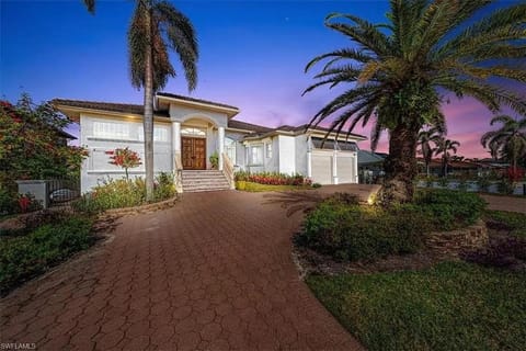 Waterfront Retreat! Breathtaking Water Views - Sparkling Pool & Dock - Walk to the Beach! House in Vanderbilt Beach