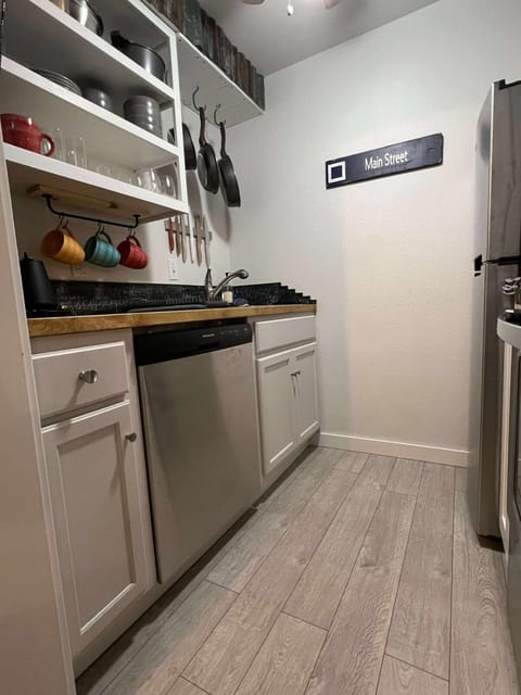 Kitchen or kitchenette, dishwasher, oven, stove