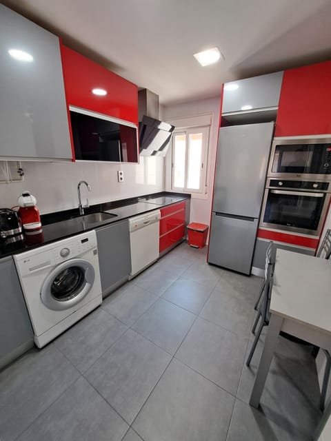 Kitchen or kitchenette, oven, stove, toaster, washing machine, kitchen