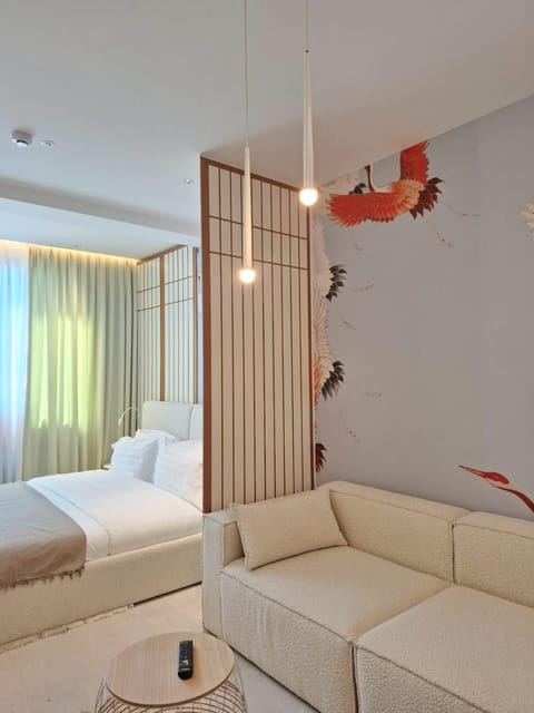 Bed, Living room, Seating area, Bedroom
