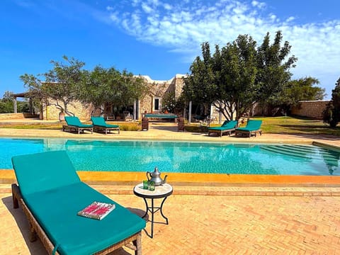 Property building, Patio, Spring, Day, Natural landscape, Pool view, Swimming pool, sunbed