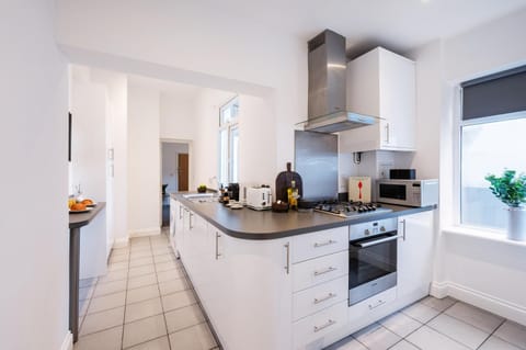 Kitchen or kitchenette, oven, stove, toaster