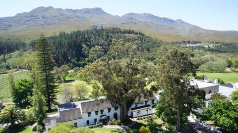 Property building, Natural landscape, Bird's eye view, Garden, Mountain view