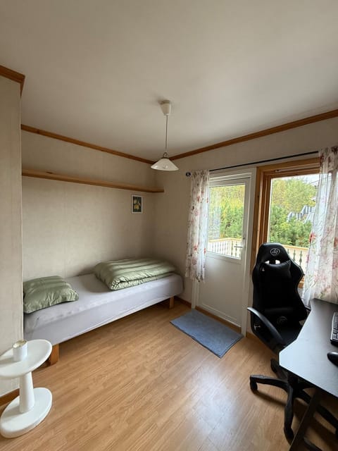 Tromsø pearl near mountains, city life and northern lights House in Tromso