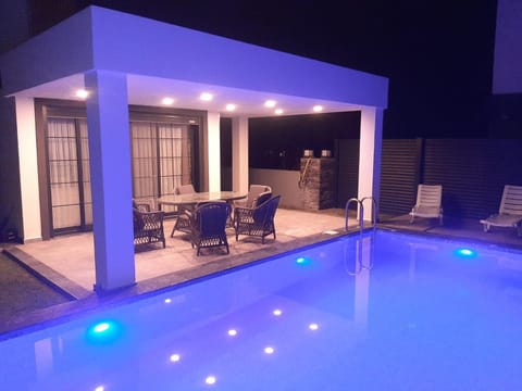 Night, Seating area, Dining area, Swimming pool