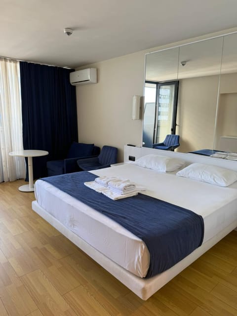 Bed, Photo of the whole room, Bedroom, towels, air conditioner