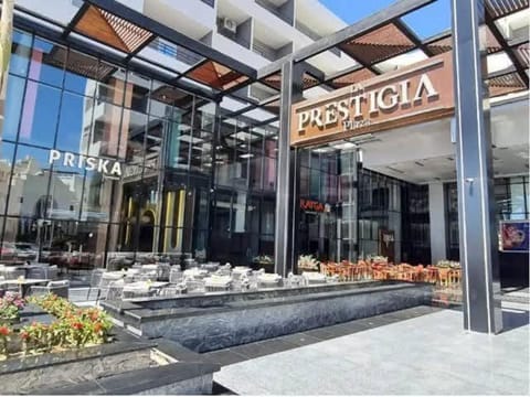 Property building, Restaurant/places to eat, Day, Text overlay, City view, Street view
