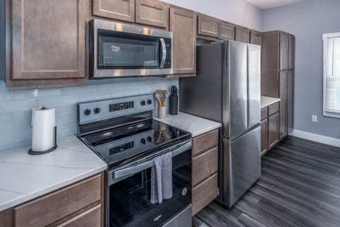 Kitchen or kitchenette, dishwasher, oven, stove, toaster