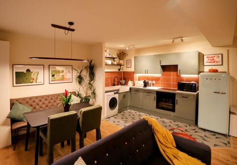 Kitchen or kitchenette, Living room, Seating area, Dining area, dishwasher, oven, stove, toaster, washing machine, dryer