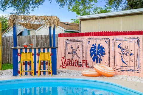 Resort Style Backyard Tiki Bar Pool Hot Tub House in Pinellas Park