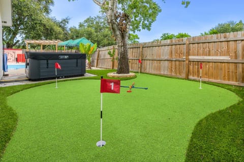 Resort Style Backyard Tiki Bar Pool Hot Tub House in Pinellas Park