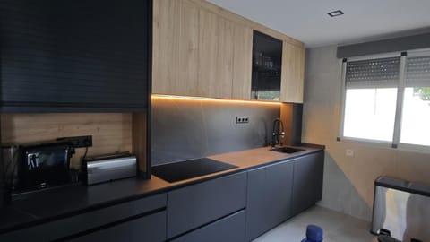 Kitchen or kitchenette, dishwasher, oven, stove, toaster