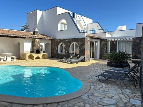 Property building, Patio, BBQ facilities, Dining area, Pool view, Swimming pool, sunbed