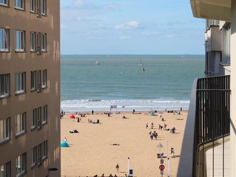 Property building, Nearby landmark, Communal lounge/ TV room, Day, People, Natural landscape, Beach, City view, Sea view, group of guests