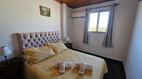 Bed, Photo of the whole room, Bedroom, towels, air conditioner