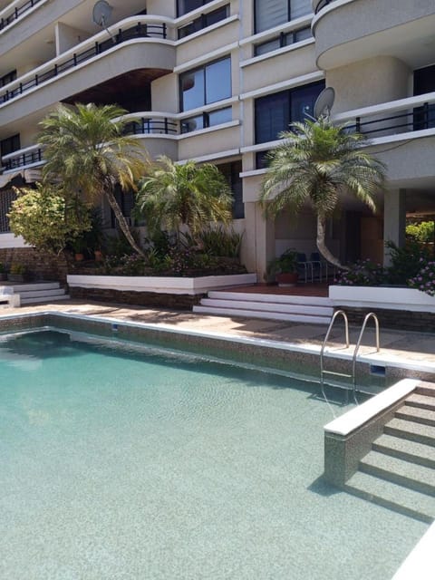 Property building, Pool view, Swimming pool, sunbed