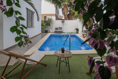 Property building, Living room, Swimming pool
