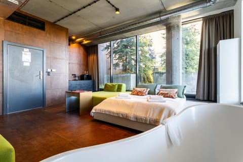 Bed, Kitchen or kitchenette, Seating area