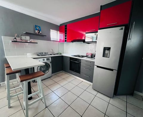 Kitchen or kitchenette, dishwasher, microwave, oven, stove