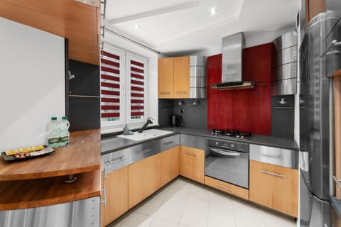 Kitchen or kitchenette, dishwasher, oven, stove