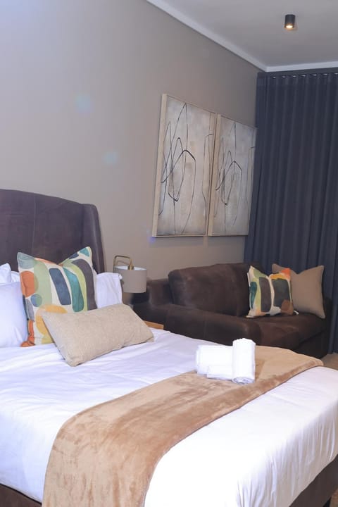 Bed, Living room, Seating area, Bedroom