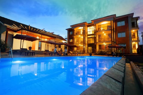 Property building, Night, Pool view, Swimming pool, Swimming pool, sunbed