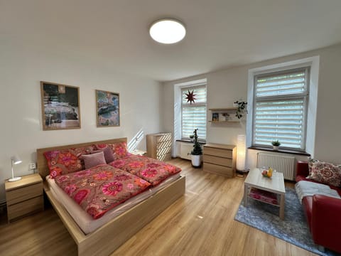 Bed, Living room, Seating area, Bedroom