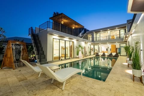 Property building, Patio, Pool view, Swimming pool, sunbed