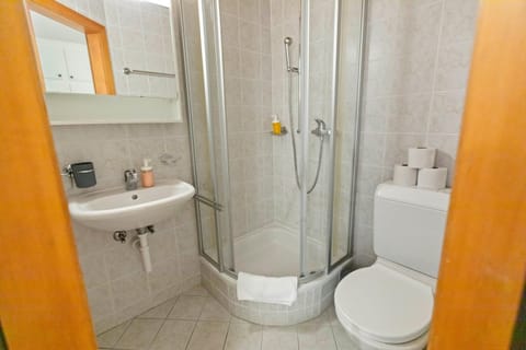 Shower, Toilet, Bathroom, hair dryier, towels