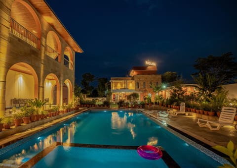 Property building, Night, Pool view, Swimming pool, sunbed