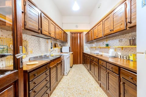 Kitchen or kitchenette, dishwasher, oven, stove