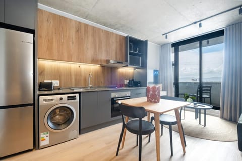 Kitchen or kitchenette, Dining area, oven, stove, toaster, washing machine