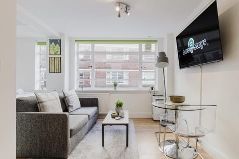 Property building, TV and multimedia, Living room, Seating area, Dining area