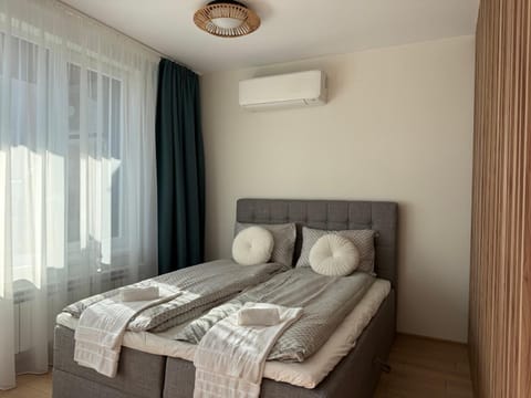 Bed, Photo of the whole room, Bedroom, towels, air conditioner