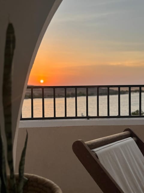 Natural landscape, View (from property/room), Balcony/Terrace, Seating area, Sunset