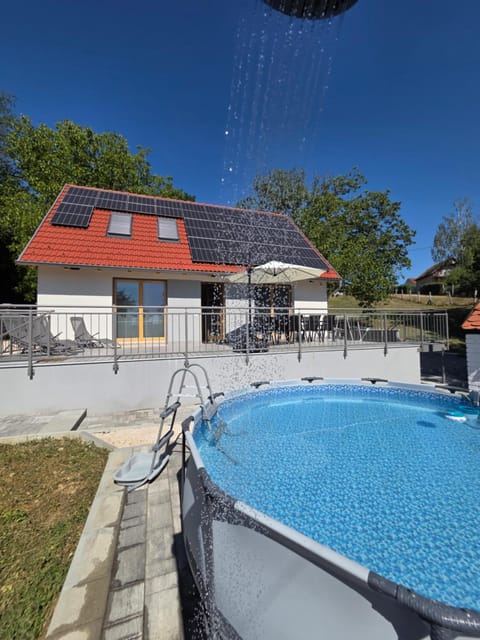 Property building, Day, Pool view, Swimming pool, sunbed