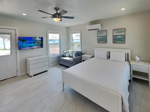 Bed, TV and multimedia, Seating area, Bedroom, furniture, air conditioner