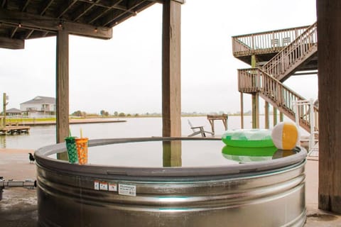 Jaw-dropping bayfront home with panoramic water views, boat slip, and cowboy pool House in Galveston Island