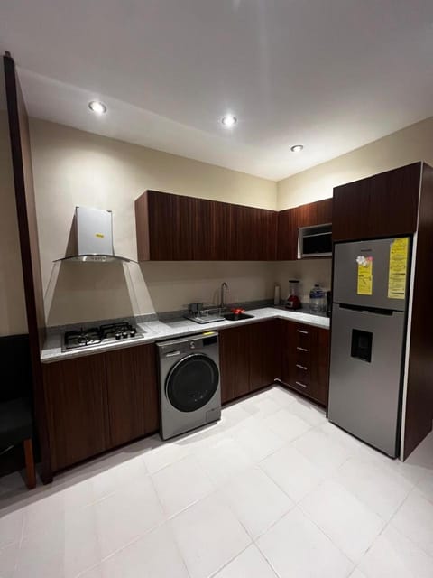 Kitchen or kitchenette, oven, washing machine, dryer